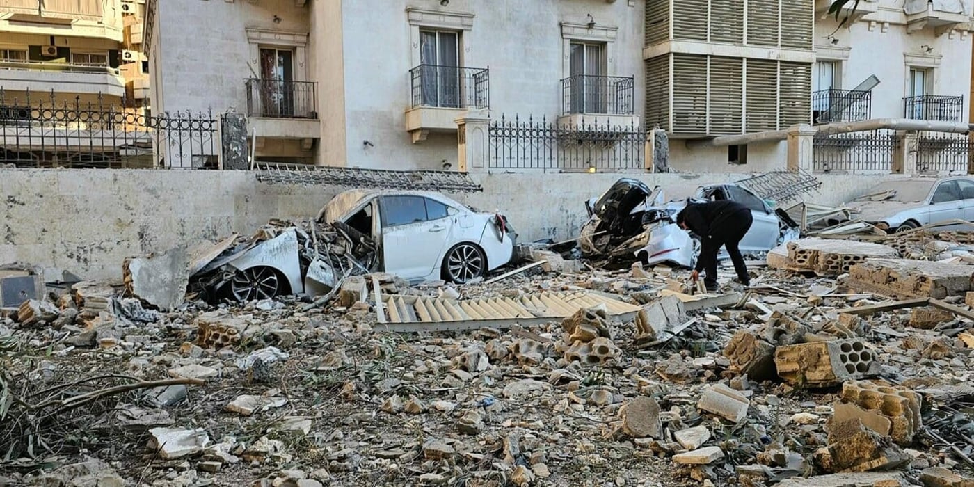 A man checks the wreckage after an Israeli air strike in the southern Beirut suburb of Haret Hreik on March 2, 2026. Photo: AFP