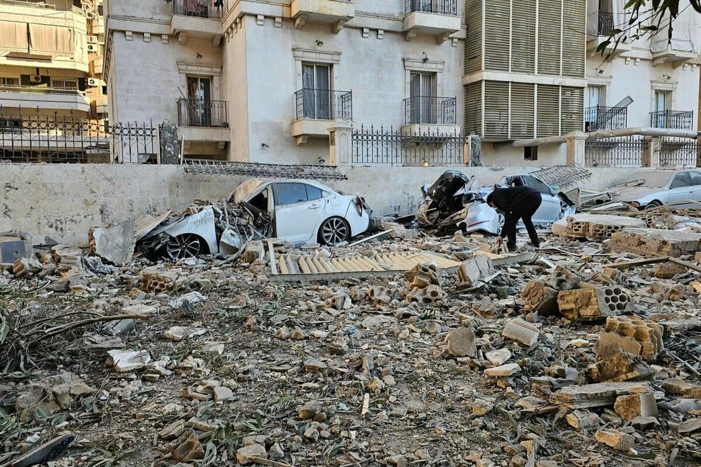 A man checks the wreckage after an Israeli air strike in the southern Beirut suburb of Haret Hreik on March 2, 2026. Photo: AFP