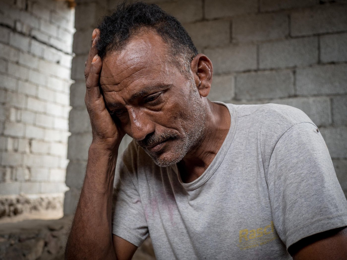 FISHERMAN 
Suleiman (45 years old) is a fisherman from Al-Hodeidah and now he is an internally displaced person in Ras Emran (Aden). His only income was fishing. Because of the war, he could not continue fishing in Al – Hodeidah after some of his friends were killed by airstrikes, and others were killed in the fish market which was hit by airstrikes several times. 

He is afraid to face his friends fate since they were killed without having committed any sins- they were only fishermen. Because of the war, he faced many difficulties in Al-Hodeidah, the high cost of living, no money to buy fishing tools and the fuel for the boat to go out to the sea.  Even before the war, his life was difficult and strenuous as he was staying   out at sea for many days, but at least it was a safe life.  Since the war started - he no longer feels safe.

When the clashes moved closer to the area where he lived, he heard people say that they should store basic food items because they would not be able to get out of their homes. Suleiman has a big family; one wife, 7 children and 2 grandchildren. He stored a few basic food items, which was enough for a few days. After a few days, the food was close to running out so he had to go out and buy some food and store it. He did this three times despite clashes coming to his area.  

One day, Suleiman made a tough decision – it was about surviving. He fled with his family, and they left with only the clothes that they were wearing. He sold his wife's jewellery and his animals to pay for transportation and travel expenses. He fled to Ras Emran (Aden) where he could continue work as a fisherman. It took three days to get here.

 As an internally displaced person he feels like a stranger in the area that he fled to. He cannot act or live as freely as he used to do in Al-Hodeidah before the war. He doesn't know the condition of his house in Al-Hodaidah. Maybe it was hit by an airstrike or is occupied by someone else.  But the most important thing for him is that he and his family are safe. 

Currently, Suleiman works together with other fishermen to provide a living for his family.  But it is not easy to find enough work. He has a wife, 7 children and 1 grandchild. He works for a daily fee between 3000 to 5000 Yemeni Riyals, and he needs many things   for his family to live as he and his family left everything behind when they fled.

Suleiman hopes that the war will end so he can return to his home. So that he can go back to his work. And his children can live in peace and safety like other children in the world and go back to school to finish their education. His message to the international community is to help and stand by Yemeni people in their ordeal and to do their best to stop this war in a peaceful manner and to make Yemen safe and secure for people.

Photo: Ingrid Prestetun/NRC