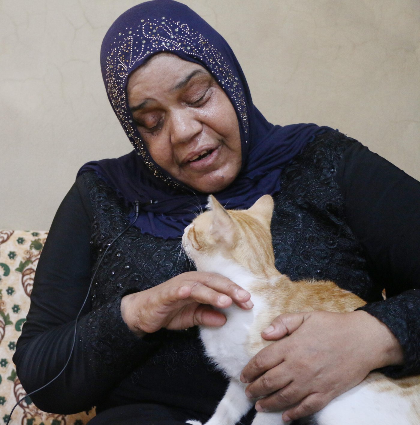 Nawal, 56, a Palestinian Refugee from Syria who lives in Lebanon.
Cat name: Antar
I raised “Antar” since he was a kitten, his mom gave birth to him in this building where I Live, now he Is two years old.
Whenever I go in the neighborhood, he follows me, but whenever he sees kids he hides from them.
He eats whatever we cook, but he doesn’t like food with tomatoes. The neighbors here like him, and get him food as well.
He likes playing with me, and he jumps on me. Once he got sick, I felt so worried about him, I asked my nephew to take him to the vet. Two days later he got better.
I got used to him, I am very attached him. I always ask about him. Some people complain that I raise a cat at home, saying that it is a dirty animal and will transfer diseases for me, but I don’t listen to them.
If I go back to Syria, I will leave him with my friend to take care of him.
I don’t want to take the risk, they might catch him on the checkpoint.
I will always remember him, and God will put other good people on his way to take care of him.
Photo: Nadine Malli/NRC