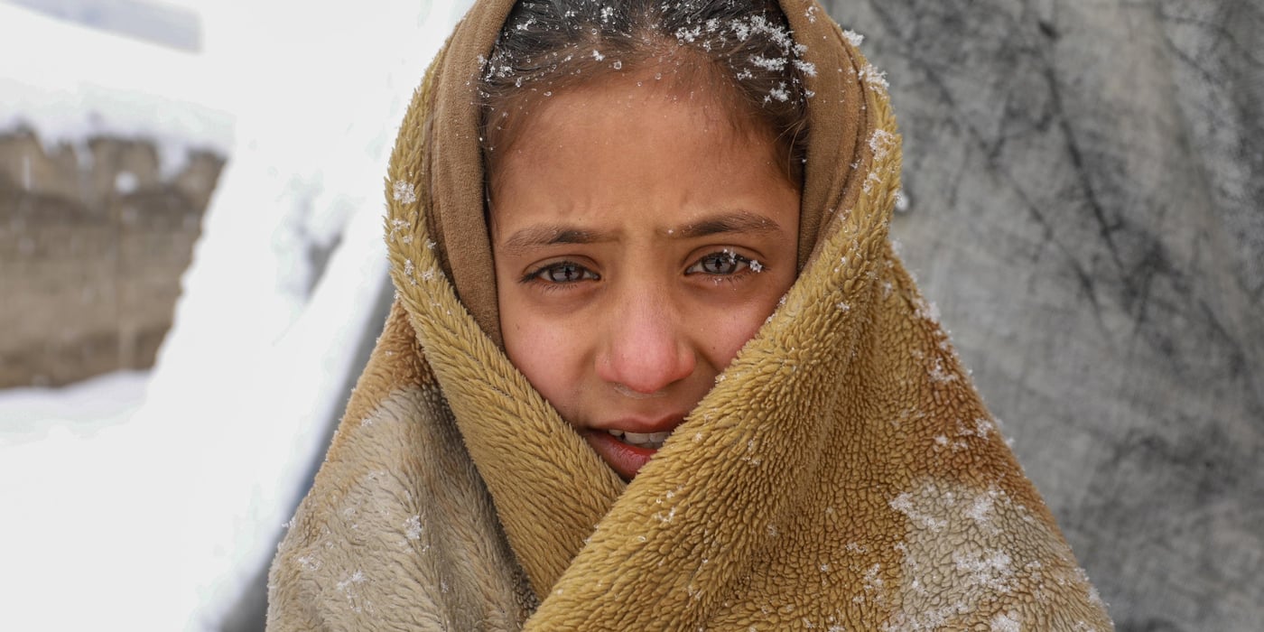 “It was very cold inside and I thought if I go outside and walk I might feel warmer,” says Roqia, 11, standing outside her makeshift home in a snowy day in KABUL. 

Rogia doesn’t have enough clothes and proper slippers to keep her warm in a cold. Her family do not have sufficient firewood to keep the oven burning all the time and they only burn it once in a day and if the weather is freezing cold, they might burn it twice in a day. They burn plastics, cartons, packets and other waste materials they have collected during the summer season. 
“The house we have is out of plastic bags, blankets and mud. As soon as the oven dies the home gets cold,” she says. “It’s very cold during the night and we wakeup many times due to cold. Sometimes, I feel pain and burn in my feet, legs and back due to the cold.” 

Kabul gets very cold during the winter and last night only, the temperature dropped to -16 Celsius. Photo: Enayatullah Azad/ NRC