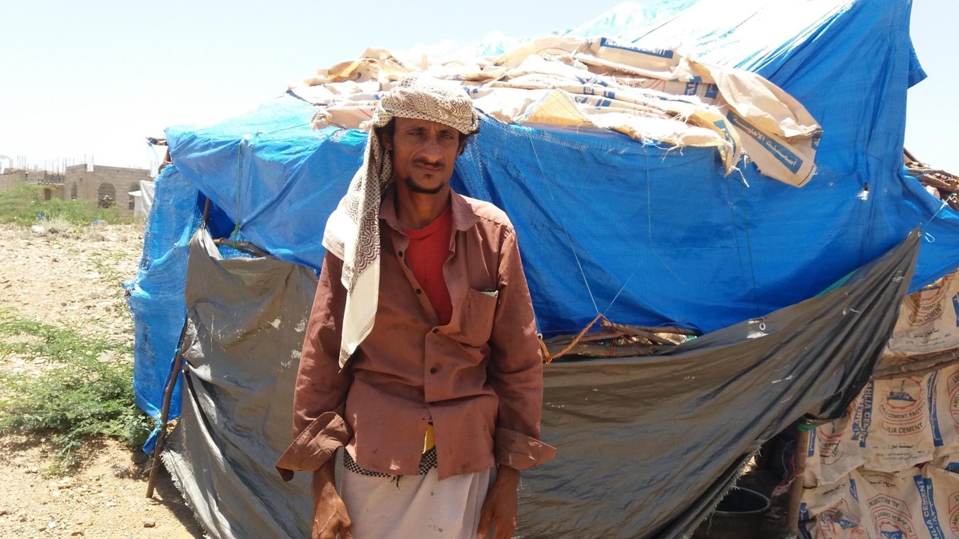 Despite hearing of other families fleeing, Ali had not thought it would happen to him. But only two weeks ago, early on 6 May, airstrikes hit his extended family on the farm where they worked.

Just like his father before him, Ali Ibrahim had spent most of his life as a farm labourer, in his home village of Al-Jar. 
 
It was hard work but peaceful, planting vegetables like tomatoes, onion and garlic. Most of Ali’s extended family worked alongside him on the same farm. Though his income was only YR1,000 (less than two dollars) a day, it was enough to support his own family of seven children.
 
“My brothers and I have been working on the farm for 15 years. We built oshas (straw huts) on the farm and we lived there, as we spent most of our time on the farm,” Ali says.

The war first intruded on them in 2015, when the price of fuel doubled, forcing the farmer Ali worked to stop all work for some months. Ali was also aware that families from other areas were fleeing their homes, but didn’t think it would happen to him.
 
“During the last few months, many families from neighboring areas fled their homes towards Al-Shaqaf village, after battles reached their area. But our area was safe.”

This changed one evening. On Wednesday 6 May, warplanes started to fly over Ali’s village. He and his family didn’t sleep that night, listening to it.
 
It was morning when the first bombs fell. From less than a hundred metres away, Ali saw his cousin’s hut hit.
 
“My cousin tried to flee the farm with his family, but an airstrike hit them… Three were killed, including a few-months-old child. And four others were badly injured.”

Other strikes followed. “Eight airstrikes hit the village and the farm in few hours, and almost all residents of the village fled their houses.”

In the ensuing chaos, Ali tried to help the injured. “We saw the deaths in front of us. I took my children and the injured people to Al-Jar clinic.” Then he fled with his family to nearby Al-Shaqaf, with only the clothes they were wearing.

“We didn’t take anything with us as we left on foot. Even the dead bodies we didn’t take. Some brave people returned the second day to bury them…. It would have been death and nothing is better than life.”

Cattle were also hit by the airstrikes. No one dared to stay. 
Ali’s children were witnesses to the burnt bodies of their friends and relatives. Some cried, while others were too shocked. They have difficult sleeping now. 

“No one can believe what happened for us and we didn’t imagine it before. I met many displaced families but I wasn’t aware they witnessed such atrocious moments.”

When his family arrived in Al-Shaqaf, they found other displaced families living in tents made of plastic sheets and wood. “As soon as we arrived here, a new journey of suffering started as we don’t have money and we don’t have furniture. But we are lucky that the displaced people [already] here welcomed us.”

Ali’s family now live inside the tent of another family, who fled their house last year. Despite being in dire circumstances themselves, this family shares food, water and everything they have with Ali, who has no money to even buy a plastic sheet to set up a new tent.

“We are in need of everything, but shelter and food is priority as we don’t want to stay in others’ tents for a long time.”
Ali doesn’t know anything about the unilateral ceasefire, nor about Covid-19 and what kind of danger it represents for displaced people.
 
“I’m illiterate man and all I know is that warplanes targeted us and forced us to leave our houses, and we lost our source of incomes in this holy month,” he added.
 
Ali hopes that he can return his village and resume his work but he feels that is impossible now. 
“The best thing was when we would wake up early in the morning and water the vegetables. And after an hour all the farmers would sit together to have their group breakfast in the farm. Those days can’t come again, as some of my relatives and colleague were killed by the airstrikes.”
 
He wanted to send a message to the whole world about his situation: “There is nothing worse than seeing relatives became burnt bodies and hearing the screaming of children all the time, so try to imagine yourselves in our situation and stop the war on us.”

Photo: Anwar Abdu/NRC