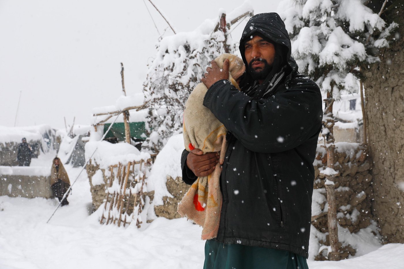Mirwais, 42, is taking his one and half year-old son Ramin, to a doctor. Ramin has been suffering headache, fever and abdominal pain in the past three days. “he has been suffering in the past three days and I was hoping he could get well without being taken to the doctor. I can’t afford their medicine and he is the second one I’m taking to the doctor,” Said Mirwais.
Kabul and major parts of Afghanistan is blanketed in snow and Mirwais and thousands other displaced men who are earning through daily wages can’t find anymore to protect their families.
“We can’t afford fuel or firewood to warm the room and cook. All we burn is plastics and cartons and that makes our children sick,” said Mirwais. Photo: Enayatullah Azad / NRC