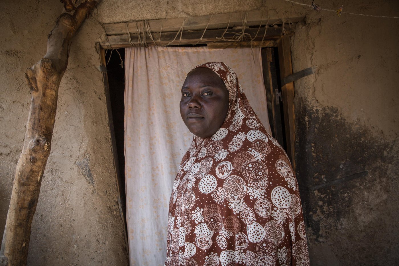 The night Boko Haram attacked Halima’s village, her husband disappeared in the chaos and she had to flee alone with her four young children. Five years have passed and she has still not heard from him. She fears he was killed that night.
Halima, 32, is not the only one that has been forced to flee her home because of attacks from armed groups in the border areas between Cameroon and Nigeria. The Boko Haram conflict in Nigeria has led to significant protracted displacements in Cameroon’s Far North region, ranking Cameroon as the second most affected country (after Nigeria) in the Lake Chad Basin region. 64% of all humanitarian needs in the country, affecting approximately 2.1 million people, are concentrated in the Far North region. This includes 227,581 internally displaced persons (IDPs), 92,238 returnees (former IDPs), 96,727 Nigerian refugees, 406,700 host community members and more than one million other vulnerable people (Humanitarian Response Plan - HRP 2018). As more and more attacks are now also happening inside of Cameroon, it is leading to more insecurity and secondary displacements. For aid agencies, access is also increasingly difficult.
“After I fled my home, we stayed in Kourgui for two months hoping that life would be better there, but it was not easy at all, so I decided to come here to Mora".
Mora is a little bit further from the border and feels a bit safer. Halima now rents a small house in a compound with another family, trying to make a new life after having lost all she once owned. Back home she had a sewing machine that gave her a steady income. Without her machine or her husband’s help, she has struggled to make ends meet. Now, with the support from NRC, her situation has turned for the better.
Halima is part of a group of women that are selected for a fish farming project that NRC supports as part of our Food Security activities. A local entrepeneur, Boucar Adji, had set up a fish farming cooperative and NRC decided to provide financial support to this great initiative. The entrepreneur used the funds to expand the fish activities and intentionally hired displaced women to work with him at the cooperative. The women receive 15,000 francs every month from the cooperative for the work they do on the fish farm. Every morning for the past three months, Halima and the other members of the association meet to feed the fish and clean the premises.
In addition, NRC has provided financial assistance directly to the women to help them start up a small business. With the first of three cash instalments, Halima chose to buy peanuts that she now roasts and sells. The income from this and the work at the fish farm has made it possible for her to pay the school fee for two of her four children. It also generates a welcome addition of fish into their diet.
"If today my small family manages to eat fresh fish, it is thanks to the fish farming done by the association," Halima ends.
Photo: Ingebjørg Kårstad/NRC