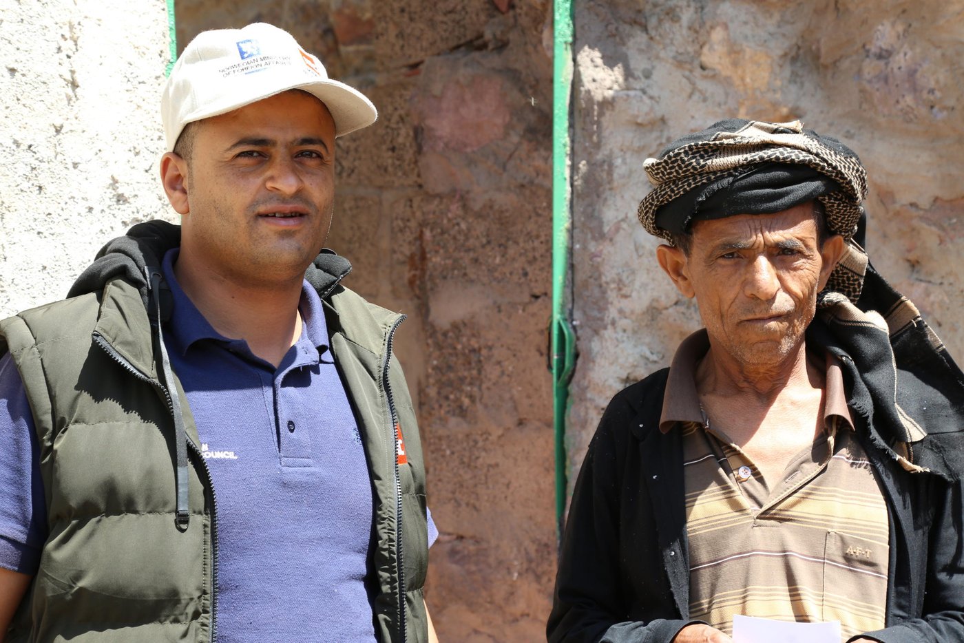Ghaleb Mohammed Al-Faqeeh, in his late 50s, is a father of 10. He used to work as a farmer before the war reached his village south of Taiz city.
Besides his work as a farmer Ghaleb used to own a car and a motorcycle which he used to transport goods from the city to residents in his village. But he lost everything when the war reached his village.
“I didn’t flee my house when the battles arrived but some fighters threatened to kill me and blow up my house if I didn’t leave so my family fled the village and left everything behind,” Ghaleb says.
He fled to Al-Qabilah village and there he worked as a labourer in a bakery. He was just about able to make ends meet but could not afford furniture and many other things for his displaced family.
“My wife tried to return to our village to bring back some belongings but a sniper shot her in the leg and injured her before she could get to the house,” Ghaleb recalls.
“She tried to go back a second time with our son but as they were entering the village they stepped on a landmine which exploded and killed them both.”
Ghaleb collected the remains of his wife and son and buried them. He suffered from a lot of regret and guilt for letting his wife and son return to the village.
“I didn’t only lose my house and car but all my hopes were dashed after the death of my wife and son,” Ghaleb says.
When the fighting in Ghaleb’s village ended, he was not able to return to his house as the roof, windows and the door were damaged. He couldn’t afford to pay for the rehabilitation of his home.
“I didn’t have money to fix my house but when I heard that the Norwegian Refugee Council was helping people who were returning to the village to rehabilitate their houses, I went back to my village without my children to repair the house. I started by fixing up one room which I stayed in while the rest of the house was being repaired.
“NRC provided us with enough money to buy windows, wood, cement and other materials needed to rehabilitate the house and I did the repairs myself.
“If it wasn’t for NRC, I wouldn’t have been able to even afford one window. The house is almost ready now, and soon my children will return and we will be reunited as a family in our home.”
“I thank NRC for supporting my family to return to our home.”
Photo and text: Nasser Abdulkareem/NRC