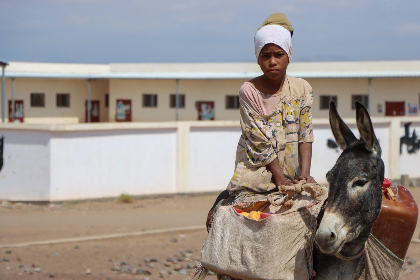 Rahaf Saleh, an 11-year-old, has to help her family with daily tasks in the camp where she lives. Fetching water in displacement camps in Yemen often falls on women and children. Before or after school, she must carry heavy containers filled to the brim and bring them back home on her donkey. "Helping my family is my priority now."

Mahmoud Al-Filastini / Norwegian Refugee Council